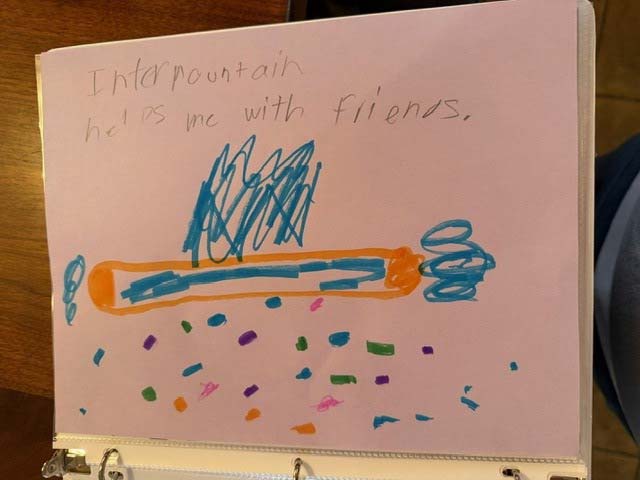 Child's artwork that reads "Intermountain helps me with friends"